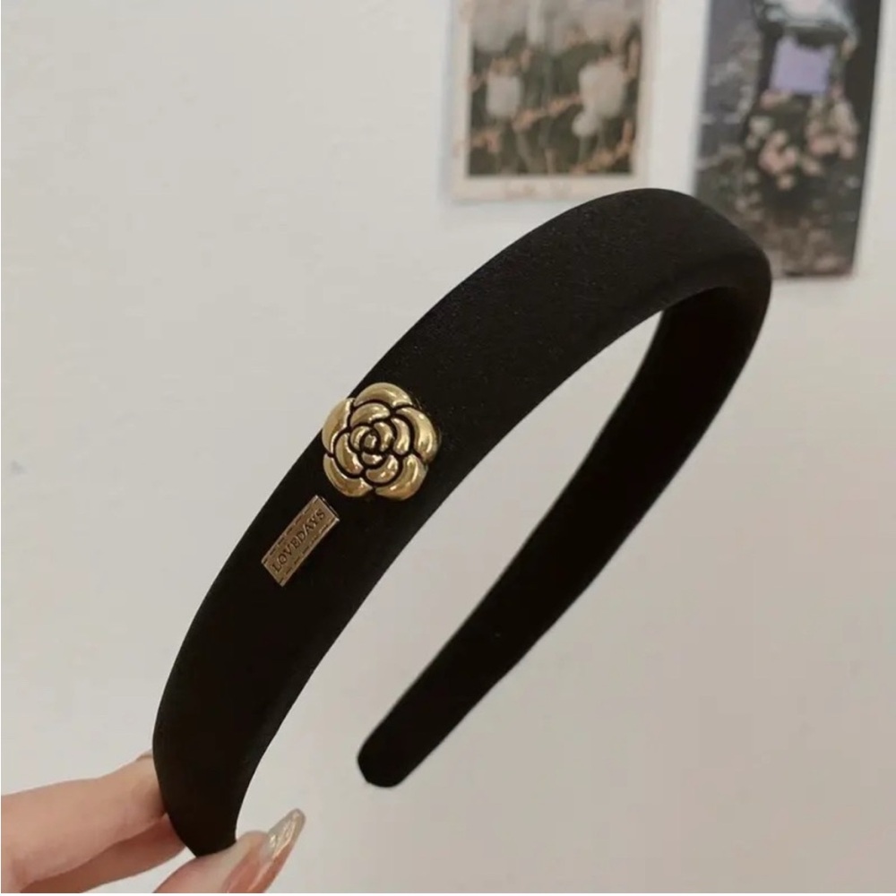 Elegant Black Headband with Gold Floral Accent
